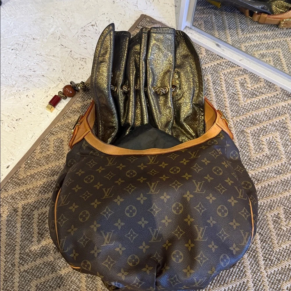 Louis Vuitton Brown Monogram Drawstring Shoulder Bag circa 2009